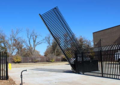 Vertical lift automatic security gate highlighting Vector Fence’s automatic gate installation services in Tulsa, Oklahoma.