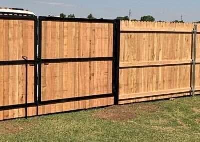 Cedar wood fence with steel frame gates showcasing Vector Fence’s cedar fence installation services.