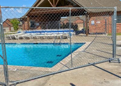 Commercial temporary construction fence installation showcasing the portable security fencing solutions provided by Vector Fence.