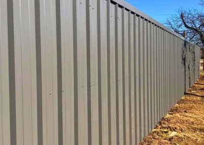 Corrugated metal privacy fence showcasing Vector Fence’s metal fence installation services.