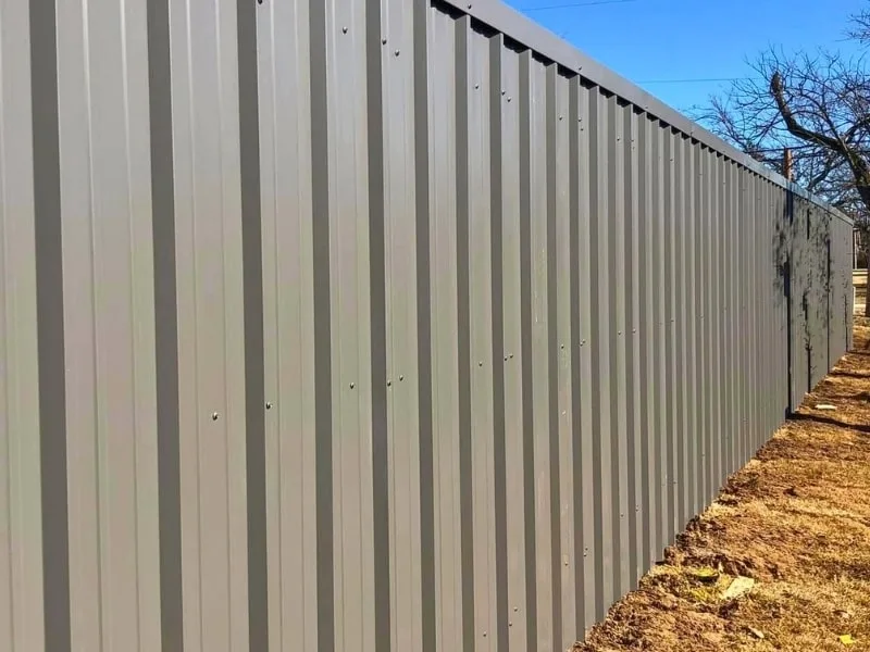Corrugated Metal Fence Installation Services in Springfield, MO | VectorFence.com Corrugated metal privacy fence showcasing Vector Fence’s metal fence installation services.