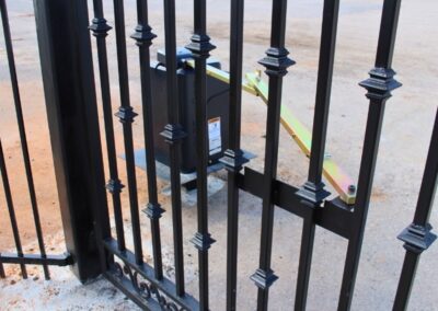 Close-up of a gate operator installed on a decorative steel gate, showcasing professional automatic gate operator installation for smooth and secure operation.