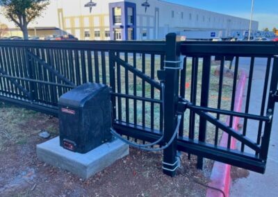 Heavy-duty industrial automatic gate with reinforced steel construction, showcased as an example of what Vector Fence can install.