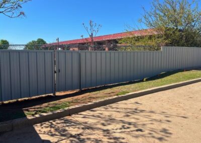 R-panel metal privacy fence highlighting Vector Fence’s metal fence installation services in Tulsa, Oklahoma.