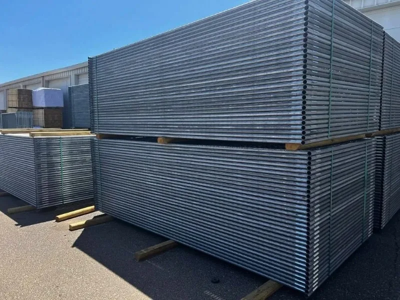 Temporary Construction Fence Panels | Vector Fence Stacked temporary construction fence panels ready for deployment, showcasing durable steel panels used for securing job sites and events.