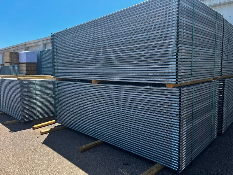 Springfield Temporary Fence Rentals | VectorFence.com Stacked galvanized temporary fence panels stored at Vector Fence Springfield, ready for commercial and construction site use.
