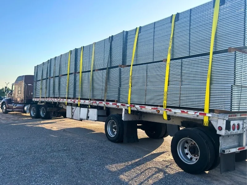 Rent Temporary Fence Panels in Springfield, Missouri | Vector Fence Truck loaded with stacked temporary fence panels, showing a large inventory ready for delivery to construction sites and events.